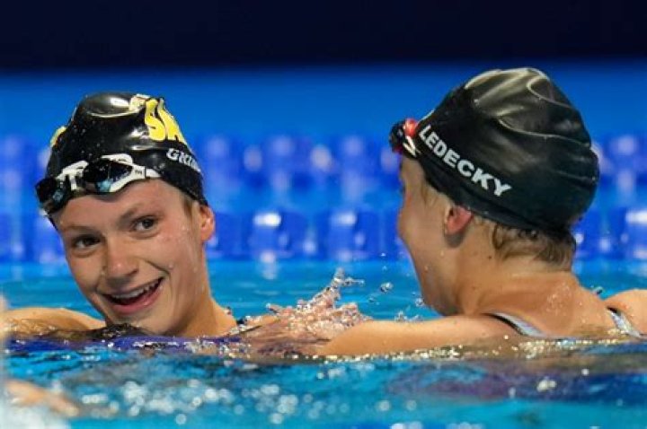 Why do swimmers wear two caps?
